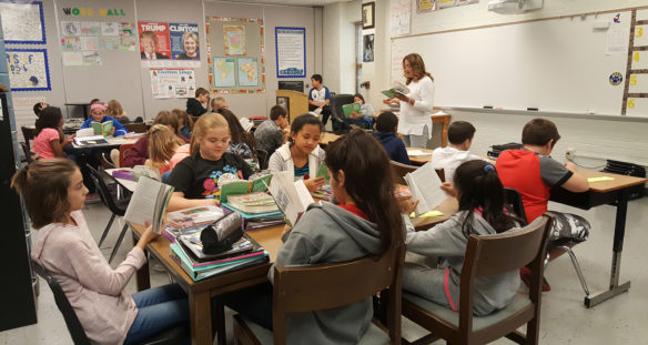 Teacher Sara Lanham reads aloud a chapter of "Saving Wonder" to her 6th-grade co-teaching social studies class at at F.T. Burns Middle School (Daviess County) as part of the school's One Book, One School program. For four weeks, all 835 students at the school spent part of a designated class period reading a chapter a day. Submitted photo by Elizabeth Muster