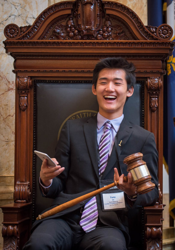 Tony Liu, a senior at South Oldham High School (Oldham County), president of the KYA Senate, has a picture taken of him with the president's gavel. Photo by Bobby Ellis, Nov. 21, 2016