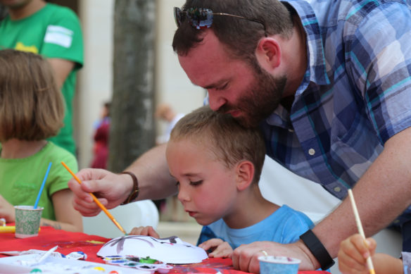 Visitors to the 2016 Global Confucius Institute Day celebration in Lexington paint a Beijing opera mask. The annual event is hosted by the University of Kentucky’s Confucius Institute, which offers a variety of Chinese language and cultural programs for K-12 students in the Commonwealth. Submitted photo by Lian Zhu, UK Confucius Institute