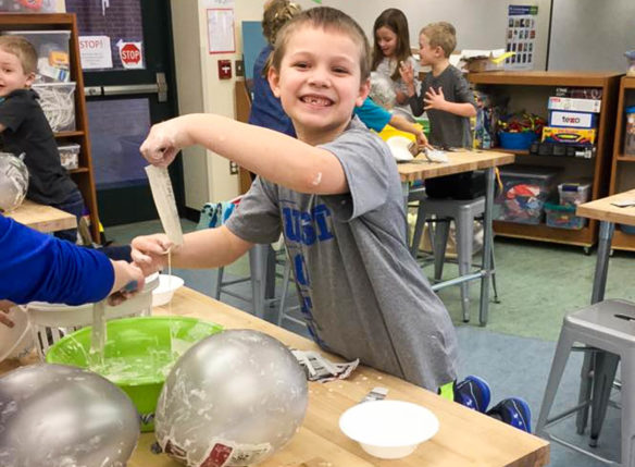 One of the highlights of the new library at Emma B. Ward Elementary School (Anderson County) is a makerspace that students can use to create class projects. First-graders like Wyatt Shouse learn about Dr. Seuss, then utilize the makerspace to create papier-mache figures of some of the author's most famous characters. Submitted photo by Tanya Blackhurst
