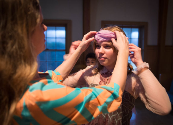 Rachel Rogers adjusts Abby Cunningham's headband during rehearsals for Mozart's "Bastien und Bastienne."<br srcset=