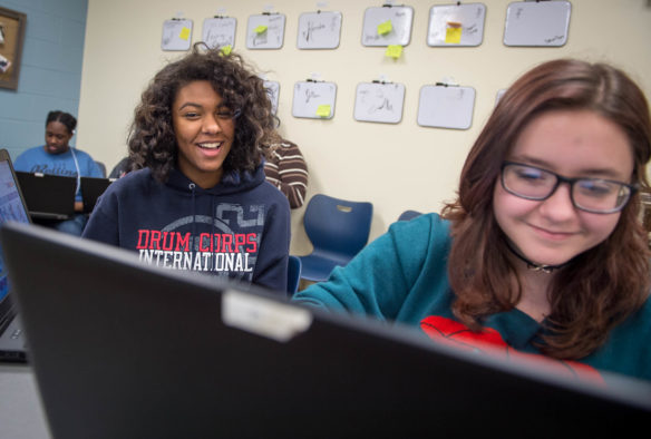 Alex Payne jokes with classmate Savannah Haynes as Haynes attempts to draw Mickey Mouse using code in Java script. Hardin County has the only Girls Who Code chapter in Kentucky that is not conducted as a club. Photo by Bobby Ellis, Jan. 30, 2017