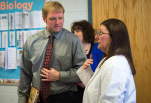Kevin Campbell, assistant principal of Perry County Central High School, speaks with Sheri Bonzo, a science teacher at East Carter High School, about how she allows students to lead her AP Biology class. Photo by Bobby Ellis, Feb. 15, 2017