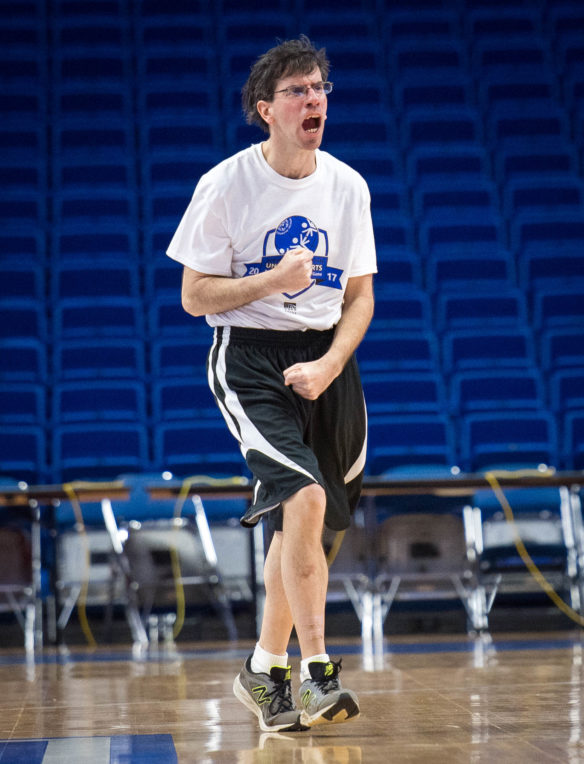 Special Olympic athlete Jonathon Lang, of Lexington, celebrates after scoring a basket during the Special Olympics and Unified sports Blue and White Game at Rupp Arena. Photo by Bobby Ellis, Feb. 21, 2017