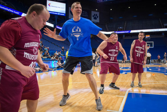 Jared Prickett, center, works on defensive skills with Special Olympics athletes during a skills clinic before the Special Olympics Blue and White game. Special Olympic athletes teamed up with former University of Kentucky players, legislators and Commissioner Stephen Pruitt in a full 40 minute game at Rupp Arena. Photo by Bobby Ellis, Feb. 21, 2017