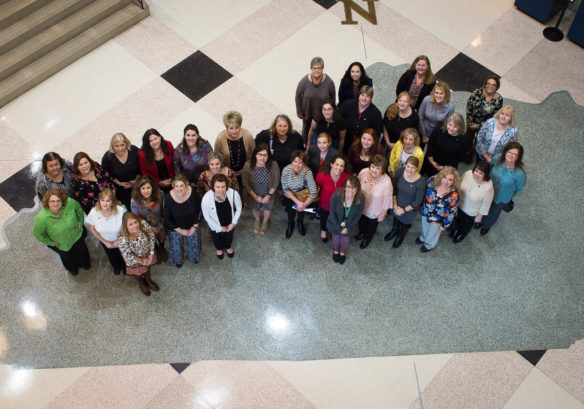 Newly certified teachers and those renewing their certification from the National Board for Professional Teaching Standards pose in the Thomas D. Clark Center for Kentucky History after a ceremony in Frankfort recognizing their accomplishment. There were 18 teachers certified for the first time last year, and 101 renewed their certification. Photo by Bobby Ellis, Feb. 23, 2017