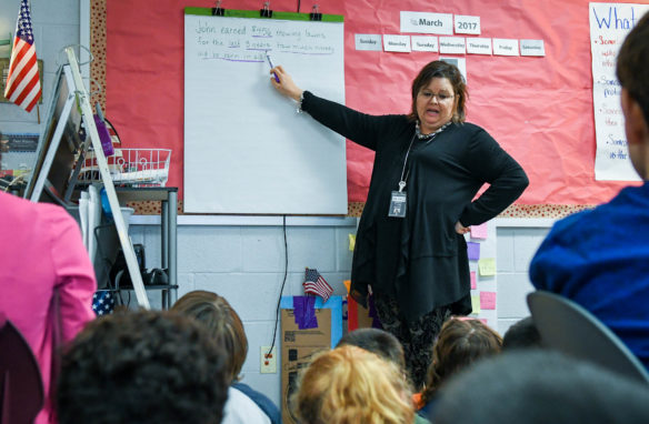 Stephanie Herndon, a 3rd-grade teacher at Clear Creek Elementary (Shelby County), reads a word problem to her class during a math lesson. Herndon serves on a committee that the principal has tasked with analyzing the TELL results and making recommendations on school improvements. Photo by Bobby Ellis, March 1, 2017