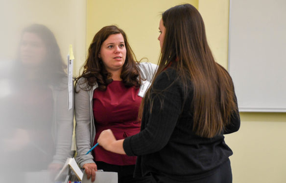 Kelly Stidham, an effectivness coach with the Kentucky Department of Education, speaks with Alysa Forden, a junior at Atherton High School (Jefferson County), before the start of her impromptu speaking challenge at the Educators Rising conference at Kentucky State University in Frankfort. The organization supports high school students who want to become teachers. Photo by Bobby Ellis, March 11, 2017