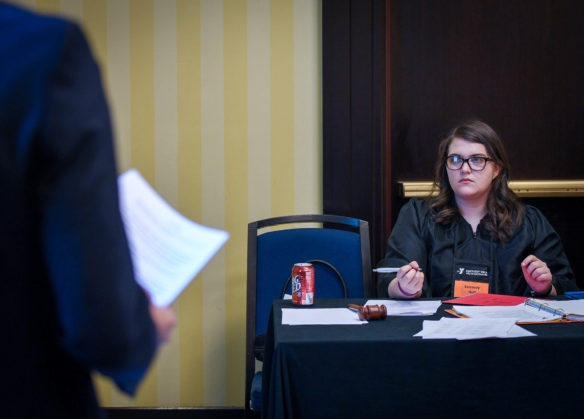 Kennedy Hall, a senior at Frankfort High School (Frankfort Independent), listens to evidence presented during a case over Japanese whaling as she acts as a judge at the KUNA International Court of Justice. Photo by Bobby Ellis, March 13, 2017
