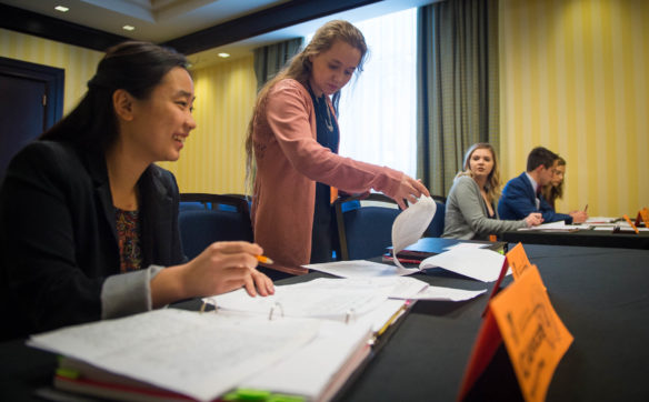 Belinda Chang, left, and Ivy Neal of Taylor County High School, present a case to the KUNA International Court of Justice. Chang and Neal were given two weeks to study 100 pages of information for their case. Photo by Bobby Ellis, March 13, 2017