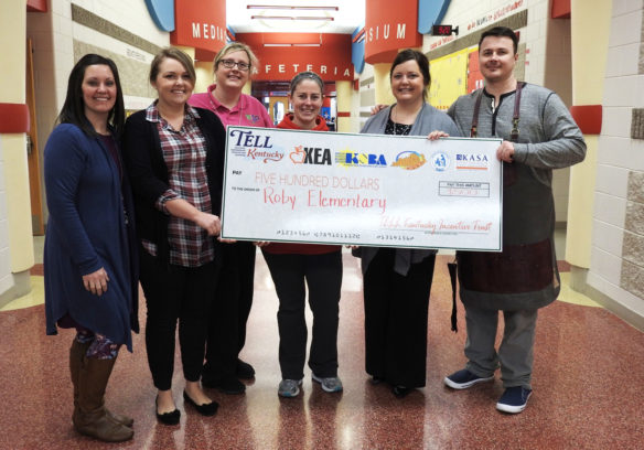 Roby Elementary School (Bullitt County) is the first school to win $500 in the weekly TELL Kentucky Survey drawings. Accepting the check, from left, are teachers Stacey Oliver, Emily Hunt, MaryBeth McCubbins and Brittany Henon; Principal Brittany Knipp; and teacher Eric Reichelle. Photo courtesy of the Kentucky Education Association