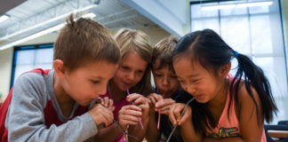 First-grade students at Lowe Elementary School (Jefferson County) use straws and different construction materials to experiment with wind while taking part in a distance learning session with the Kentucky Science Center. The center offers distance learning programs for students at all grade levels. Photo by Bobby Ellis, March 14, 2017