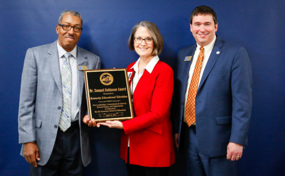 Shea Hopkins, executive director and chief executive officer of Kentucky Educational Television, receives the Dr. Samuel Robinson Award on behalf of KET from Commissioner of Education Stephen Pruitt, left, and Kentucky Board of Education Chairman William Twyman at the board’s meeting in Frankfort on April 12. Photo by Mike Marsee, April 12, 2017