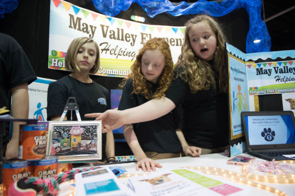 Madie Lawson, left, Kendall Hall and Emma Bailey of May Valley Elementary School (Floyd County) present their STLP project about "Helping Hands" at the STLP Championship in Lexington. The students worked to help local animal shelters get more food for pets. Photo by Bobby Ellis, April 12, 2017