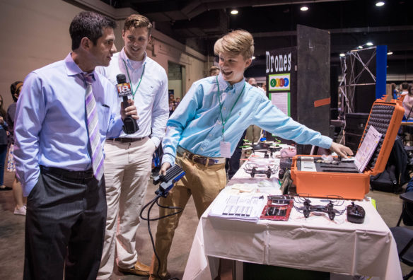 Palmer Collett, a freshman at Western Hills High School (Franklin County), is interviewed by Michael Berk of WLEX 18 during the STLP State Championship about his drone project.