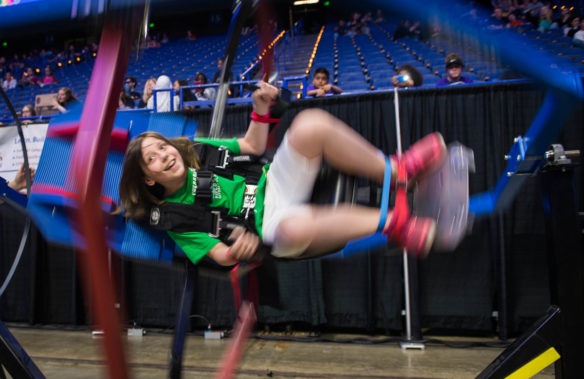 Isabell Hagan, a 5th-grader at Field Elementary School (Jefferson County), rides on a gyroscopic chair at the STLP State Championship.