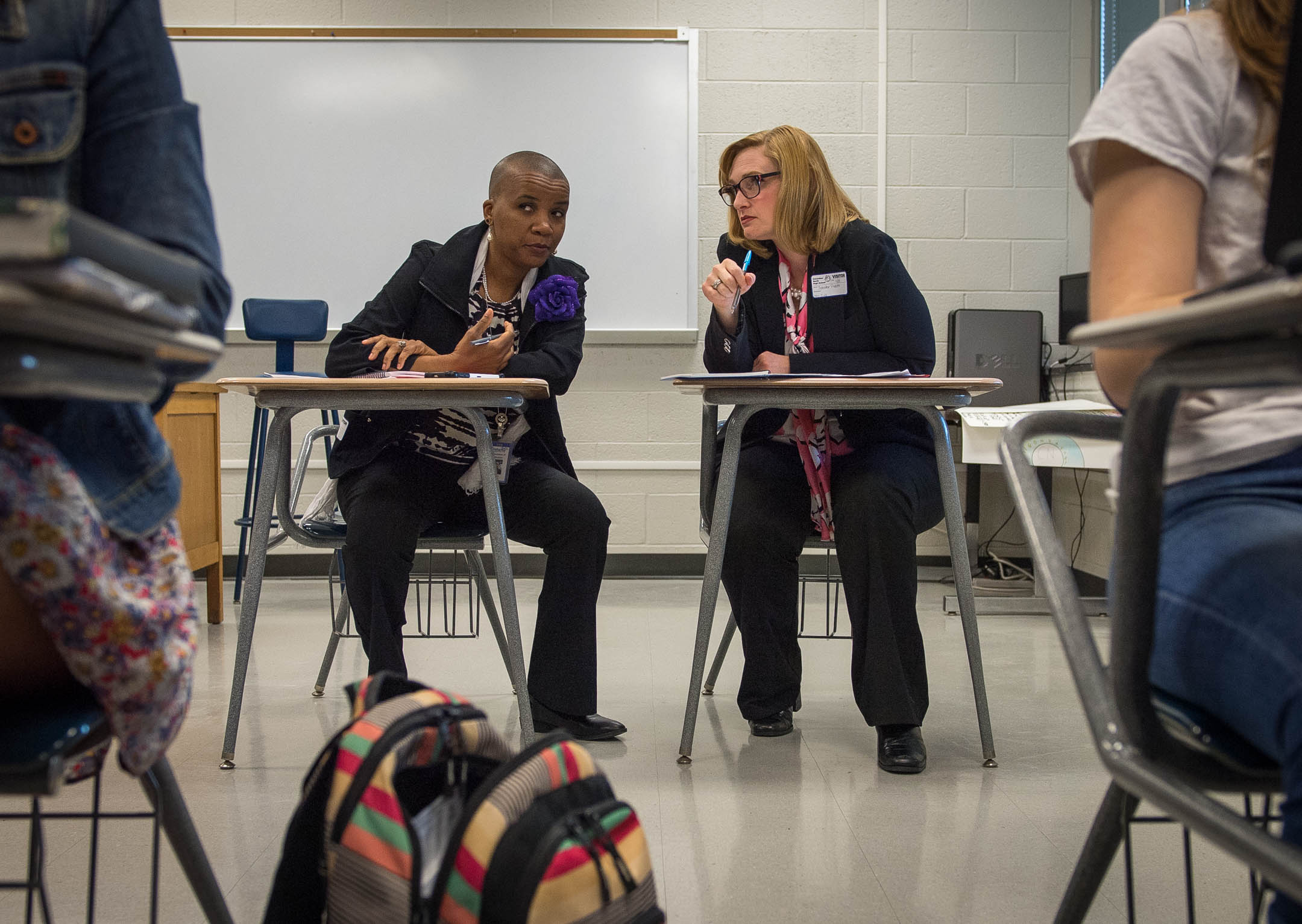 James-Etta Goodloe, left, and Jennifer Pusateri take notes while observing a class at Columbus North High School in Columbus, Ind. The school has been using Universal Design for Learning and Culturally Responsive Teaching concepts for more than a decade. Photo by Bobby Ellis, April 13, 2017