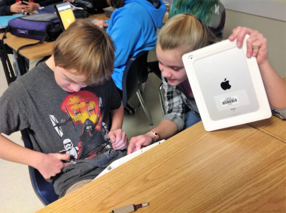 Abigail Slade and Tarin Ackerman, both 8th-graders in Angel Justice’s social studies class at East Jessamine Middle School (Jessamine County) play a game of Kahoot to review for a test. Justice pairs students with disabilities with other students in her classes as a way to foster independence and academic growth. Submitted photo by Ellen Bloyd, Jan. 24, 2016