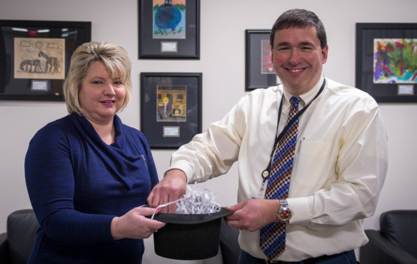Stephanie Winkler, president of the Kentucky Education Association, draws the final TELL Survey winner with Commissioner of Education Stephen Pruitt. Nearly 91 percent of educators completed the working conditions survey this year. Photo by Bobby Ellis, April 3, 2017