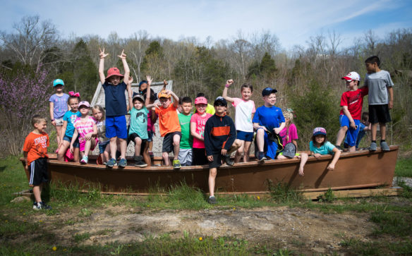 Western Elementary (Scott County) 4th-grade students gather for a photo in a canoe at Salato Wildlife Center. Photo by Bobby Ellis, April 14, 2017