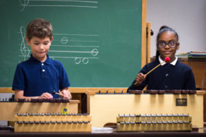Dylan Zaldivar-Tellez, left, and Giselline Peralta-Danger practice the xylophone during a music class at Schaffner Traditional Elementary (Jefferson County). Photo by Bobby Ellis, April 18, 2017
