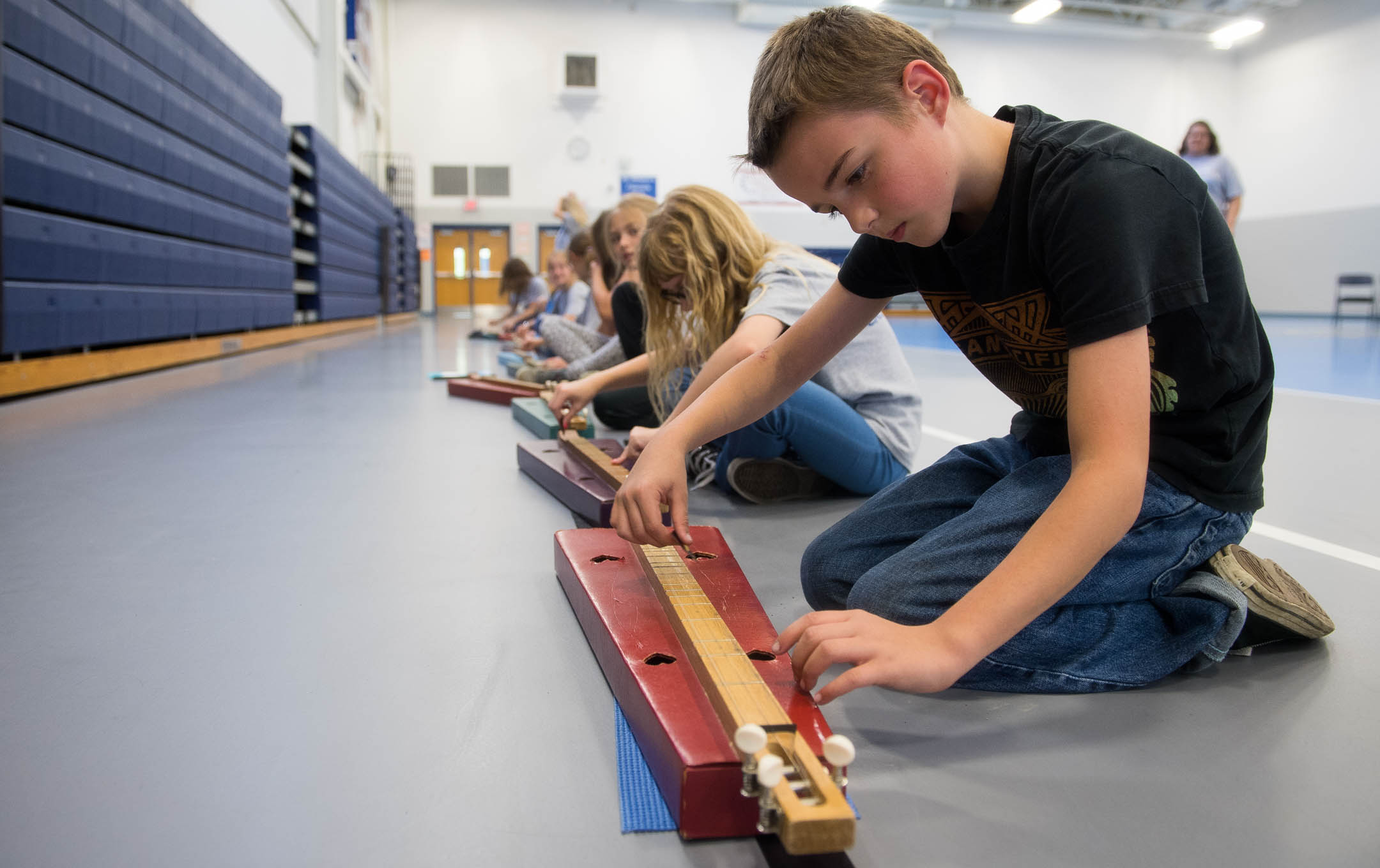 George Whitehead, a 3rd-grader at Walton-Verona Elementary (Walton Verona Independent) practices with a cardboard dulcimer. The group meets after school once a week and plays at community events. Photo by Bobby Ellis, May 10, 2017
