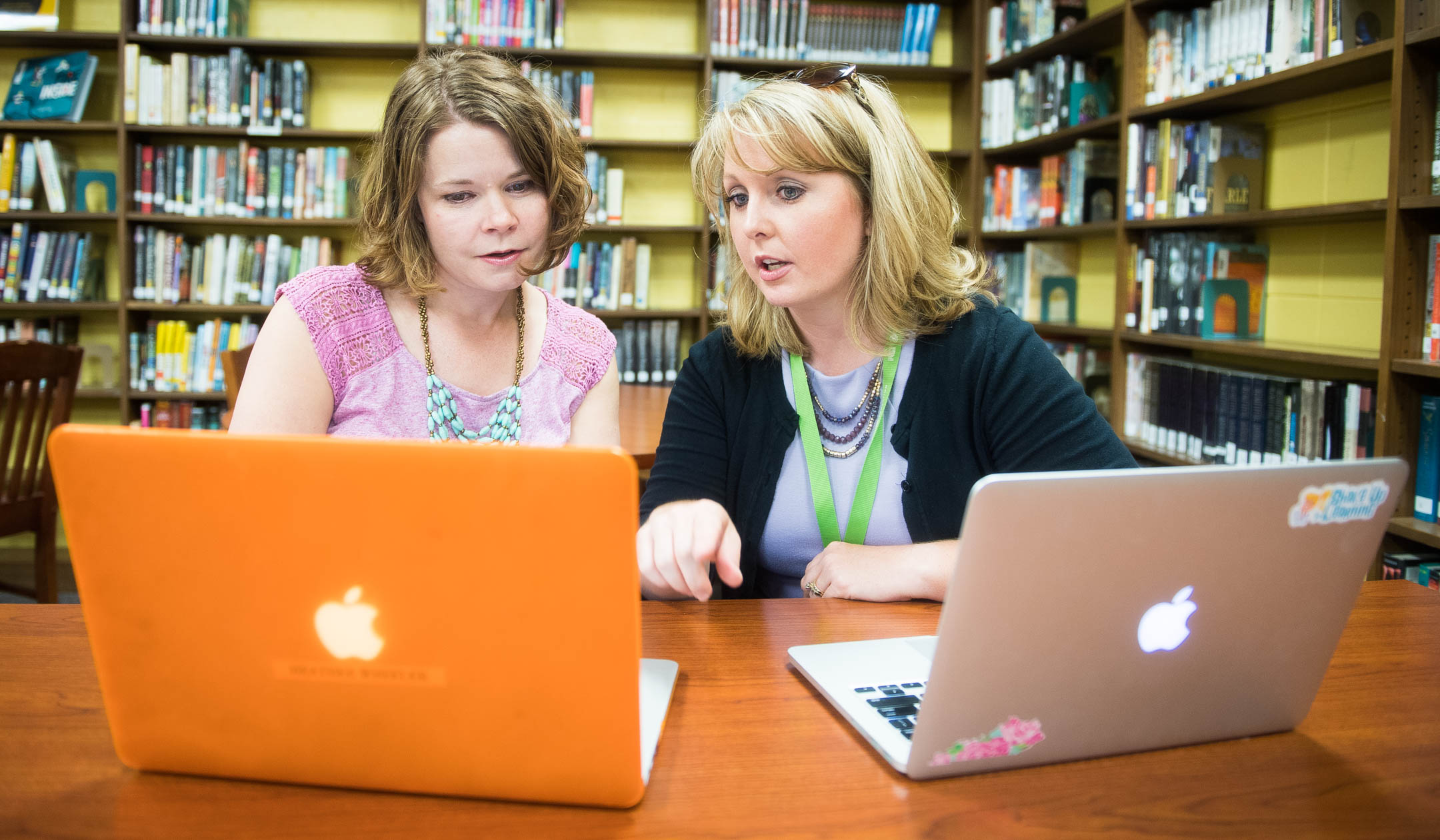 Stephanie Wade, right, the technology integration specialist for Boyle County schools, works with Heather Wheeler, a Spanish teacher at Boyle County High School, on Flipgrid, a program Wheeler uses to help her students submit assignments. Wade filled a newly created position in 2014 in which she collaborates with teachers to help them better use instructional software and network resources. Boyle County has since enlisted other teachers and library media specialists to assist her. Photo by Bobby Ellis, May 18, 2017