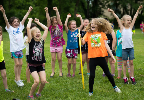 A group of girl students at Taylorsville Elementary celebrate after being a group of boys in a hoola-hoop relay during field day at Taylorsville Elementary. Photo by Bobby Ellis, May 23, 2017