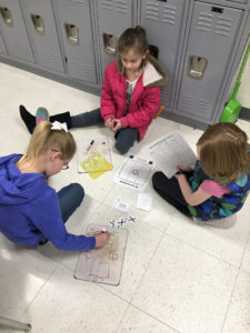 Students find area and perimeter in a group tic-tac-toe game. Submitted photo by Emily Chandler