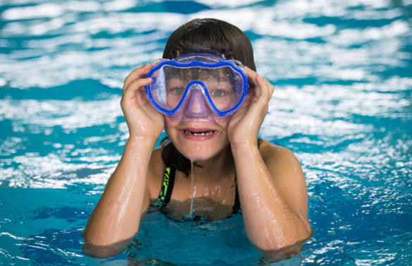 Abby Cummins adjusts her goggles while swimming in the pool at the Kentucky School for the Deaf.<br srcset=