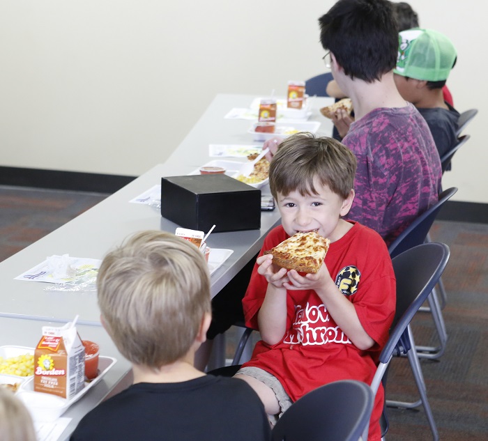 Neighborhood children enjoy a free, nutritious meal as part of the statewide Summer Food Service Program. To locate an SFSP feeding site, call the National Hunger Hotline at (866) 3HUNGRY or (866) 348-6479. Meals also can be located by texting "Food" to 877-877. Photo by Mike Marsee, June 15, 2017