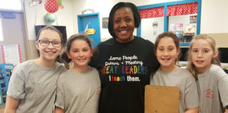 Principal Tamala Howard of Uniontown Elementary School (Union County) snaps a quick picture with 5th-grade students, from left, Evan Logsdon, Olivia Burke, Kaitlyn Thompson and Maggie Baird from the school's Leader in Me Student Lighthouse Team. Union County was one of 22 school districts to participate in kid·FRIENDLy – Kids Focused, Responsible, Imaginative, Engaged and Determined to Learn – funded by a $41 million Race-to-the-Top-District grant that focused on helping schools build personalized learning and discover ways to empower students. (Photo submitted)