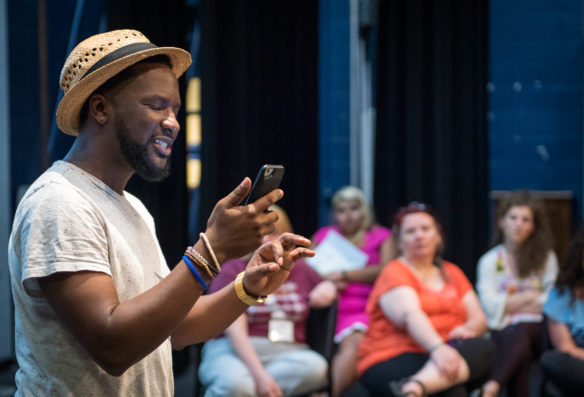 The Louisville poet, Brandon "B.Shatter" Harrison, performs one of his spoken word poems for a group of teachers at during the Arts-Literacy Integration Academy. Spoken word poems helped teachers see the connection of music and literature through rhythm.