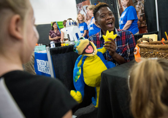 Celes Smith uses a dinosaur puppet to talk to students during the Bullitt County Kindergarten Kickoff.  Photo by Bobby Ellis, July 25, 2017