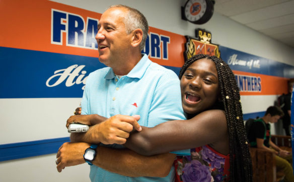 Craig Foley, vice-principal of Frankfort High School, gets a hug from Kiani Tatum on the first day of school.  Photo by Bobby Ellis, Aug. 1, 2017