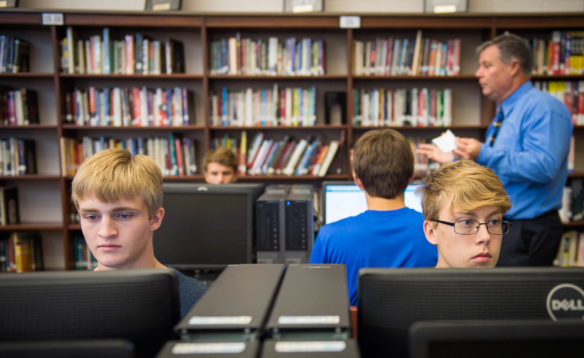 Adam Garrett, left, and Garrison Page, students in the AP Computer Science Principles class at Glasgow High School, log onto a website used to teach students coding. A new initiative in Kentucky will expand students' computer science opportunities, which includes a plan to offer the popular new AP Computer Science Principles course in at least 150 additional high schools. Photo by Bobby Ellis, Aug. 22, 2017