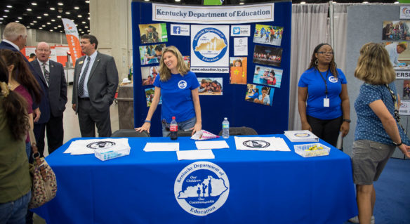 Commissioner Stephen Pruitt, left, Karen Dodd and Lacheena Carothers speak with visitors to the Kentucky Department of Education booth at the 2017 Kentucky State Fair.  Photo by Bobby Ellis, Aug. 24, 2017