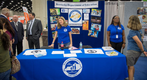 Commissioner Stephen Pruitt, left, Karen Dodd and Lacheena Carothers speak with visitors to the Kentucky Department of Education booth at the 2017 Kentucky State Fair. Photo by Bobby Ellis, Aug. 24, 2017