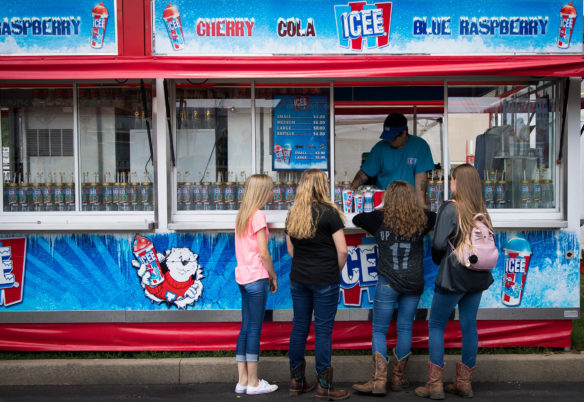 A group of fairgoers buy Icees while visiting the 2017 Kentucky State Fair. Photo by Bobby Ellis, Aug. 24, 2017