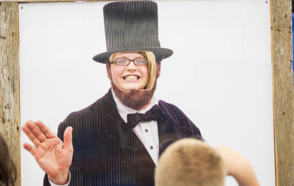 Lillianne Valentine, of the Phoenix School of Discovery (Jefferson County), poses as Abraham Lincoln at the Kentucky State Fair. Photo by Bobby Ellis, Aug. 24, 2017
