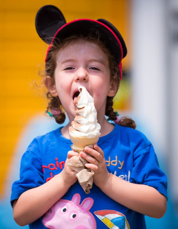 Mollie Helfman enjoys an ice cream cone at the Kentucky State Fair.  Photo by Bobby Ellis, Aug. 24, 2017