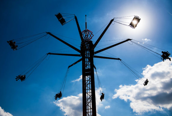 Fair goers ride the swings at the carnival at the Kentucky State Fair. Photo by Bobby Ellis, Aug. 24, 2017