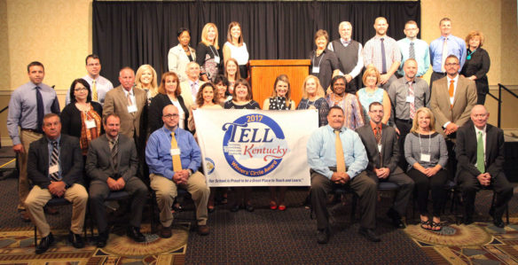 Representatives from 10 Kentucky public schools receive Winners' Circle Award banners at the Continuous Improvement Summit in Lexington recognizing their efforts for effective teacher and school leadership practices based on the results of the 2017 Teaching, Empowering, Leading and Learning (TELL) Kentucky Survey. Photo by Brenna Kelly, Sept. 18, 2017