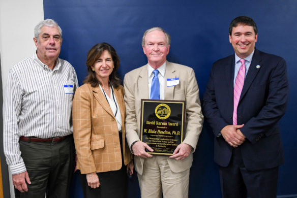 Former Kentucky Board of Education (KBE) member and state legislator David Karem (far left) and KBE Chair Mary Gwen Wheeler, accompanied by Commissioner Stephen Pruitt (far right) presents the first David Karem Award to Dr. Blake Haselton (holding plaque). The award is given to state policymakers, education leaders or citizens who have contributed to the improvement of education. Photo by Bobby Ellis, Oct. 4, 2017