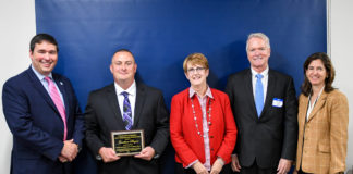 Jonathan Bogar, second from left, a welding instructor at Belfry Area Technology Center, received the 2017 Kevin M. Noland/Mary Ann Miller Award for significant service to Kentucky's public schools. At the presentation on Oct. 4 were, from left, Commissioner of Education Stephen Pruitt, Chief of Staff Mary Ann Miller, former long-time KDE employee Kevin Noland and Kentucky Board of Education Chair Mary Gwen Wheeler. Photo by Bobby Ellis, Oct. 4, 2017