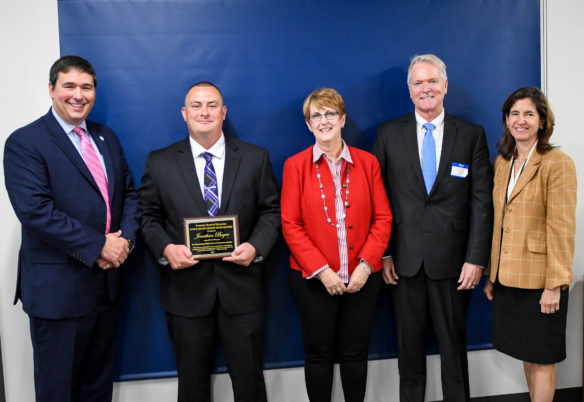 Jonathan Bogar, second from left, a welding instructor at Belfry Area Technology Center, received the 2017 Kevin M. Noland/Mary Ann Miller Award for significant service to Kentucky's public schools. At the presentation on Oct. 4 were, from left, Commissioner of Education Stephen Pruitt, Chief of Staff Mary Ann Miller, former long-time KDE employee Kevin Noland and Kentucky Board of Education Chair Mary Gwen Wheeler. Photo by Bobby Ellis, Oct. 4, 2017