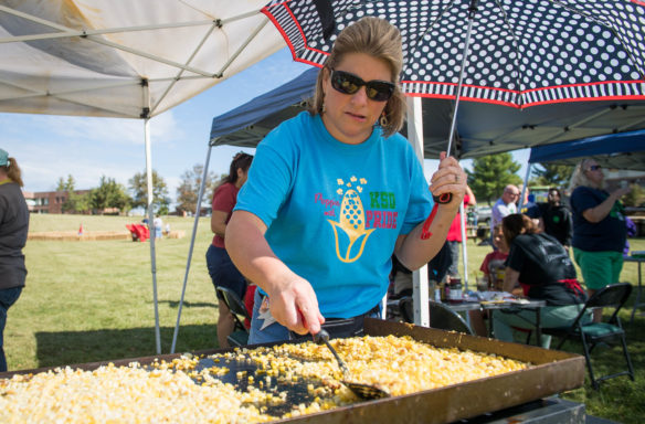 Mandy Byrne, the culinary arts teacher at the Kentucky School for the Deaf, fries sweet corn during the school's Sweet Corn Festival. Photo by Bobby Ellis, Oct. 6, 2017