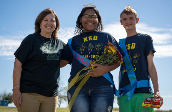 Toyah Robey, the principal of the Kentucky School for the Deaf, left, poses with Mikeyla Crumble and Jesse Rice after they were named the Sweet Corn Festival queen and king. Photo by Bobby Ellis, Oct. 6, 2017