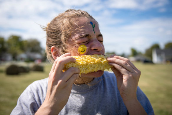 Abriana Norris, a 12th-grader at KSD, competes in the corn eating contest. Photo by Bobby Ellis, Oct. 6, 2017