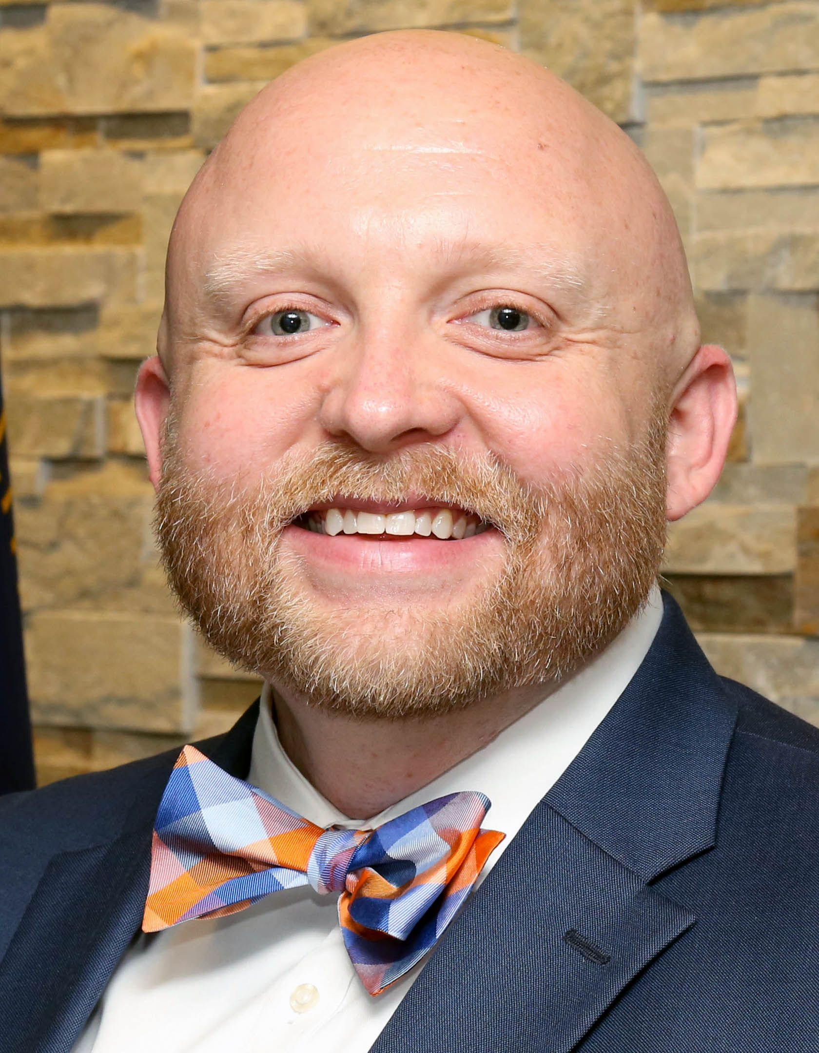 Picture of a smiling man wearing a bow tie.